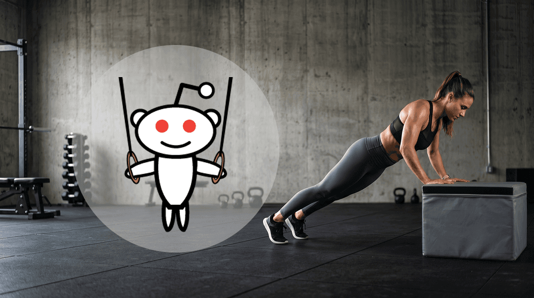 Athlete at the top of a strict pull-up in a minimalist concrete gym